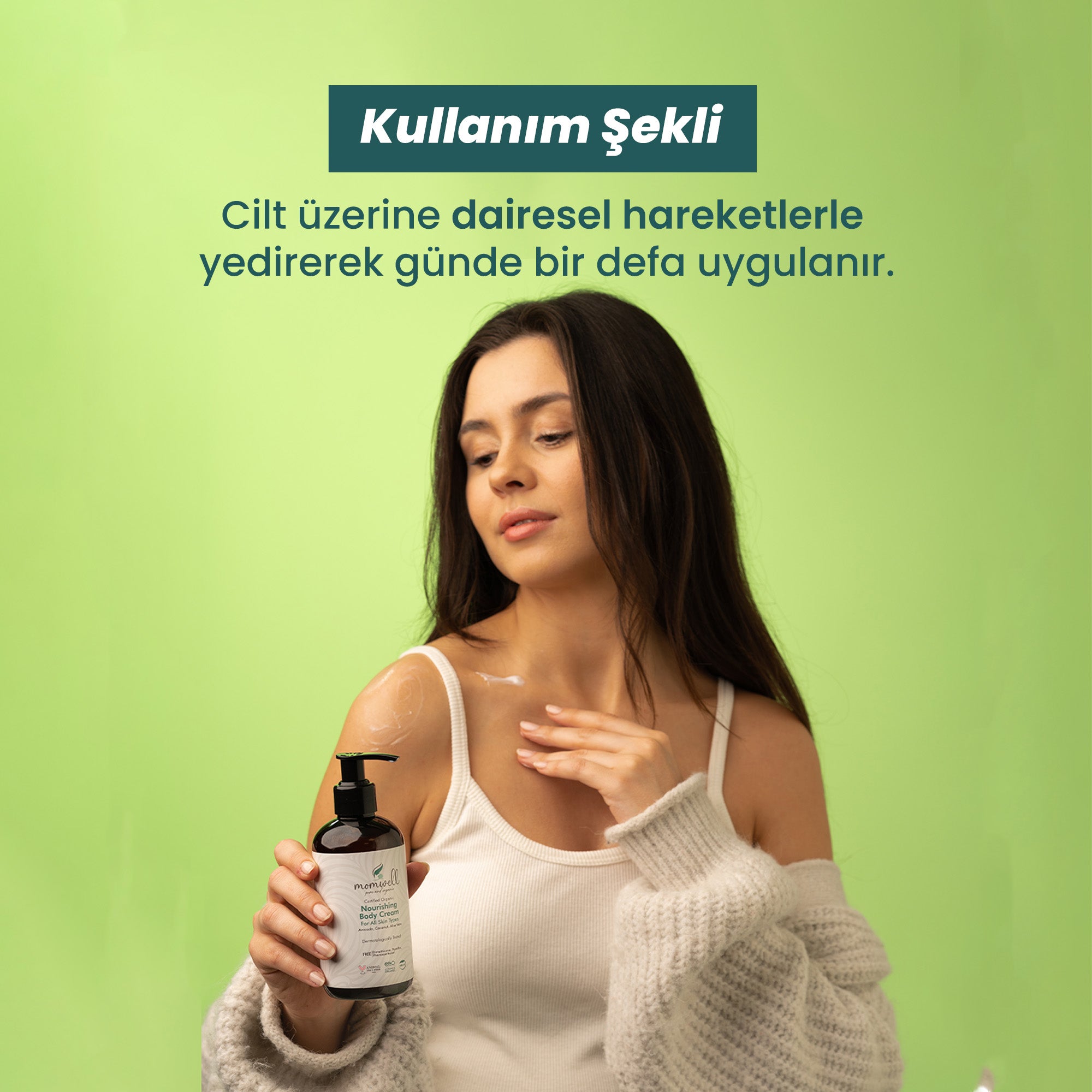 Momwell Besleyici Vücut Kremi kullanım gösterimi; kadın model cildine dairesel hareketlerle krem uygular, arka plan açık yeşil tonlarındadır