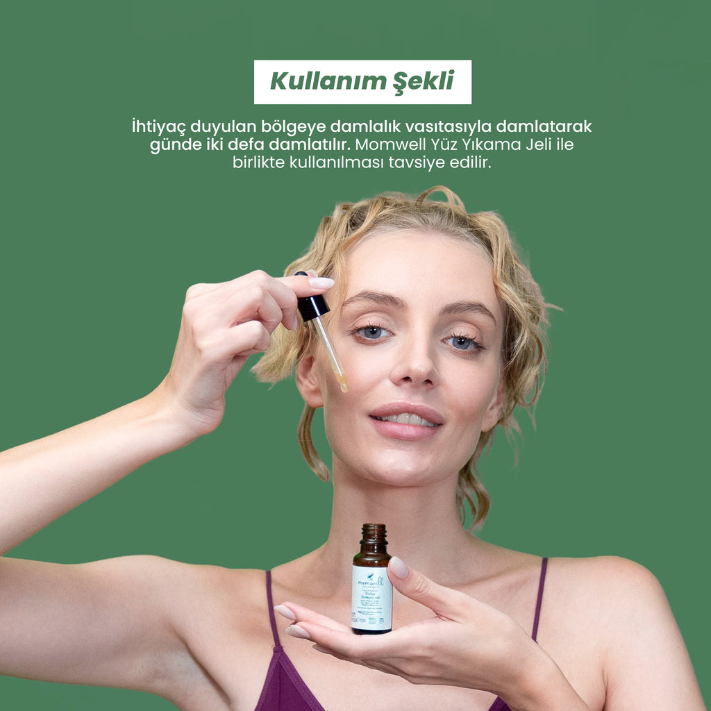 Kadın model, Momwell sivilce önleyici jeli damlalık ile cildine uygularken